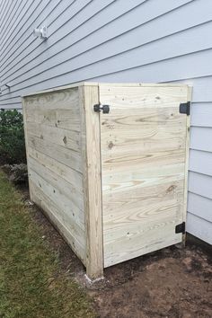 a wooden trash can with the words make this trash enclosure on it's side