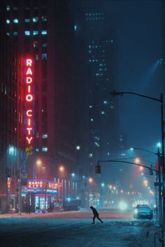 a person crossing the street at night in front of a radio city sign and buildings