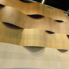 an artisticly designed wooden wall in a building