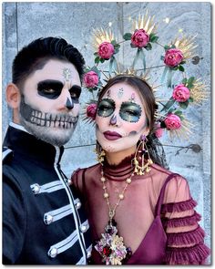 a man and woman are dressed up in skeleton makeup for the day of the dead