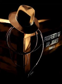 a brown hat is sitting on top of a black box with the words property of dr jones