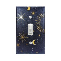 a light switch cover with sun, moon and stars on the night sky painted on it