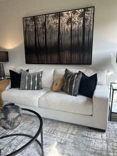 Beige linen sofa in a moody ambiance. Striking painting above the sofa with dark, hand-painted trees with a silver and orange background. Cream Sofa Living Room, Bright Sofa, Beautiful Color Palettes, Luxury Sofas, Cream Sofa, Luxury Sofa, With Mom, Foam Cushions, Understated Elegance