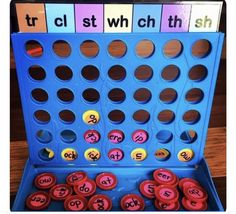 a blue board game with letters and numbers on it