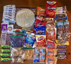 an assortment of snacks and condiments laid out on a table