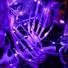 halloween decorations with purple lights and skulls