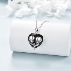 Discover the elegance of our Sterling Silver Crystal Pendant Necklace, featuring a heartshaped design available in black, rose, and retro silver, perfectly suited for women who embrace a blend of modern sophistication and timeless charm. Expertly crafted from highquality sterling silver, this unique necklace showcases a stunning heartshaped crystal pendant, embodying both romantic and edgy aesthetics with options in black, rose, and retro silver finishes. The intricate design includes subtle sku Rose Skull, Skull Pendant Necklace, Silver Necklaces Women, Heart Shaped Jewelry, Heart Crystal, Crystal Pendant Necklace, Crystal Rose, Skull Pendant, Silver Heart Necklace