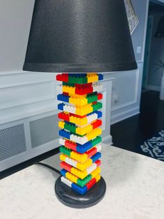 a lamp made out of legos sitting on top of a table