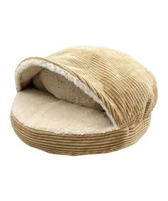 a cat bed with a corded covering on the top and bottom, in beige