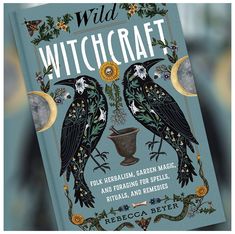 a book with two black birds sitting on it's cover and the title wild witchcraft