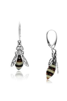 These stunning bee drop earrings finished in solid sterling silver feature a beautiful contrast of Milky & Cognac Baltic Amber forming the body of the design. These earring make a perfect gift for any bee lover Complete with butterfly back fittings. An incredible piece of natural history made from fossilised resin deposited from prehistoric trees, the beauty of Baltic Amber has made it a glowing organic gemstone that continues to capture its wearers. All Yorkshire Jewellery Company products Antique Amber Sterling Silver Jewelry, Silver And Amber Earrings, Amber Sterling Silver Drop Earrings, Amber Sterling Silver Dangle Earrings, Honey Bee Jewelry Sterling Silver, Baltic Amber, Jewelry Companies, Yorkshire, Fossil