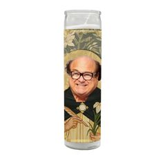 a candle with an image of a priest on it