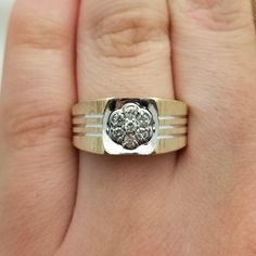 This is a very nice men's ring with intricate lined details and .21 TCW diamonds. The gold has a subtle matte finish, and the ring has an overall MCM look to it.  The head measures 1/2" and the shank is 4.5mm (3/16"). - Has a two-tone look - Seven diamonds clustered on top for .21CTW - Each diamond is 2mm round - Substantial but not bulky 4.43g weight Amethyst Cocktail Ring, Vintage Cocktail Ring, Filigree Pattern, Rainbow Quartz, Classic Earrings, Pearl Earrings Dangle, Vintage Band, Diamond Cluster Ring, Men's Ring