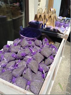 purple candy is on display in front of a store window with other items behind it