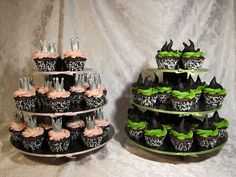 two tiered cupcakes are decorated with black and pink frosting