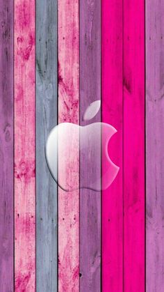 an apple logo painted on the side of a wooden wall with pink and blue stripes