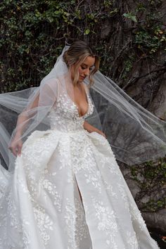 a woman wearing a wedding dress and veil