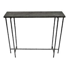 a black marble top console table with metal legs and an iron base, on a white background