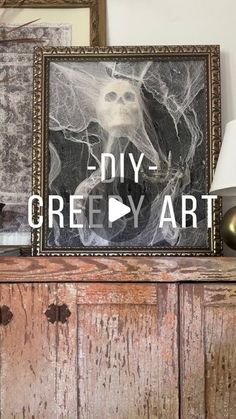 an old wooden cabinet with some pictures on it and a sign that says diy - creepy art