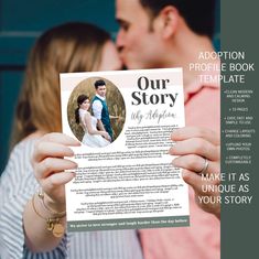 a man and woman kissing while holding up a story book for their wedding photo shoot