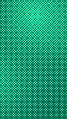 a green textured background with small dots in the center and bottom half of it