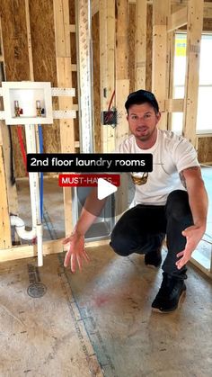 a man kneeling down in a room under construction