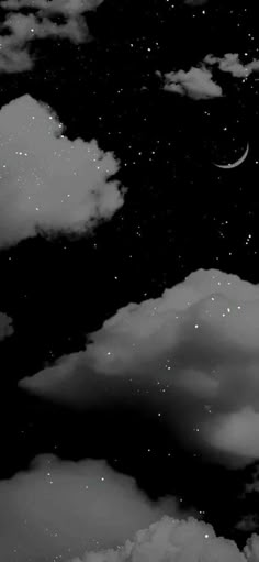 black and white photograph of the night sky with stars, clouds and moon in it