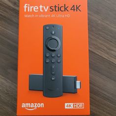 an amazon fire tv stick sitting on top of a box