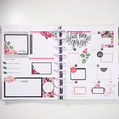 an open planner book with pink flowers on it