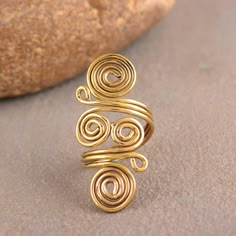 Spiral Brass Ring, Swirl Ring, Gold Wired Ring, Big Spiral Ring, Hypnotic Ring, Boho Ring, Wired Band, Spiral Band Handmade Dainty Ring Size :- All size are available METAL :- Brass ❥ Customers satisfaction is our biggest priority, please contact us with any questions/queries for future or existing orders, and we will do our best to make sure you are happy with your order. ♥ Please Make Sure to Include The Correct Address During Before Order. You Can return Item within 30 Days After Successful Delivery. We Offer 100% Money Back Guarantee If You Not Satisfied With Your Purchase. Return Charge Will Be Paid By Buyer Only. This is my shop link https://www.etsy.com/in-en/shop/AustereGifts?ref=seller-platform-mcnav Thank you🥰 for shopping with us! Wired Ring, Jewelry Tutorials Free, Gold Wire Ring, Handmade Copper Bracelet, Gold Ring Design, Diy Wire Jewelry Rings, Wire Jewelry Earrings, 22k Gold Ring, Wire Jewelry Rings