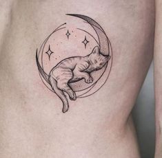 a woman's stomach with a cat sleeping on the moon and stars above it