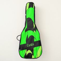 a green guitar case sitting on top of a white wall with the word curtis printed on it