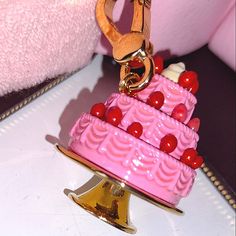 Offered Is An Exceptionally Well-Benched Three Tiered Juicy Couture Strawberry Shortcake Charm. This Exceedingly Hard-To-Find Rare Collectable Charm Sports Miniature Red Strawberries With Decorated Pink Icing With A Dollop Of Whipped Cream On The Apex Of The Cake. Set In Dazzling Gold Hardware, This Is A Stunner. This Is An Authentic Juicy Couture Treasure And We Offer This Retired Beauty In Brand New Condition. It Has Never Been Worn And Will Be Shipped In It's Original Box Accompanied With Upc Juicy Charm Bracelet, Strawberry Shortcake Keychain, Juicy Charms, Charm Bracelet Juicy Couture, Cupcake Jewelry, Juicy Cotoure Charm Bracelet, Juicy Couture Necklace, Juicy Couture Jewelry, Pink Icing