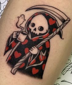 a skull with a sculler on his arm holding a knife and heart - shaped bones