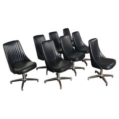 six office chairs with black leather upholstered on the back and chromed legs