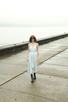 Our stylish, must-have version of the essential LBD (little ​beach dress), the Sage Maxi Dress Baby Blue is a flowing asymmetric dream that’s perfect for mid-summer events, beach days, and travel. The silhouette is inspired by the tranquil vibes of Tulum’s beaches and bustling energy of its town center. It features long straps you can wrap twice around the waist for an adjustable fit. Breathable fibers keep you cool as you lounge, explore, and indulge all summer long. Sage Maxi Dress, Dress Baby Blue, Mid Summer, Town Center, Summer Events, Beach Days, Beach Dress, Asymmetric Hem, Tulum