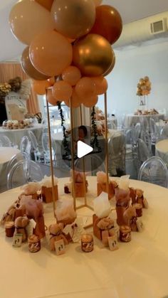 a table topped with lots of balloons on top of it