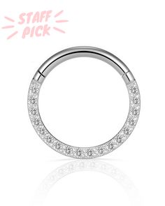 an open nose ring with clear stones on the inside, and a white background that says staff pick