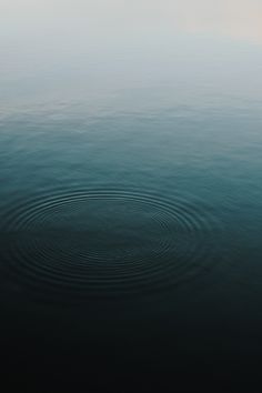 a large body of water with ripples in it