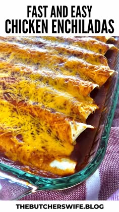 a casserole dish with cheese and chicken enchiladas in the bottom