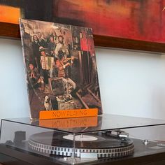 a record player sitting on top of a table