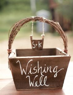 a wooden basket that has some writing on it