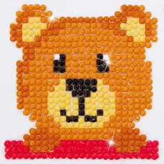 an orange bear made out of plastic beads