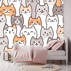 a wallpaper with many cats on it in a child's room, including a bed