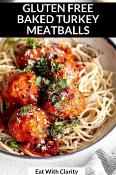 a bowl filled with spaghetti and meatballs