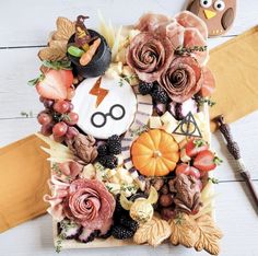 a table topped with lots of food and decorations