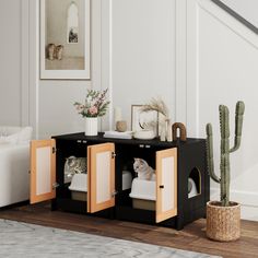 a living room with a cat in the cabinet