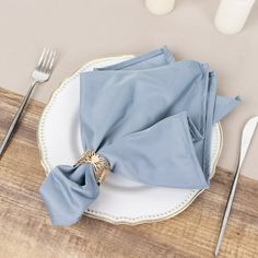 a plate with napkins and silverware on it