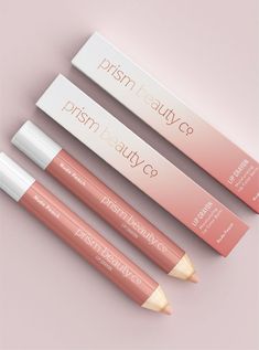 three lip pencils sitting next to each other