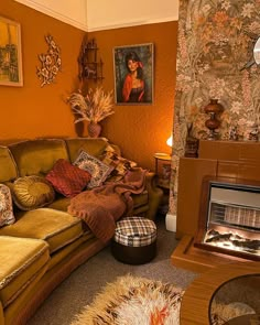 a living room filled with furniture and a fire place